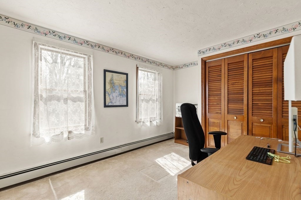 166 Edge Hill Road Sharon, MA 02067 - Photo 23 of 34 a view of a workspace with furniture and a window