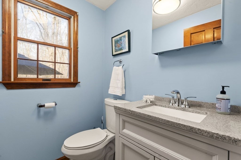 166 Edge Hill Road Sharon, MA 02067 - Photo 24 of 34 a bathroom with a toilet a sink and a mirror