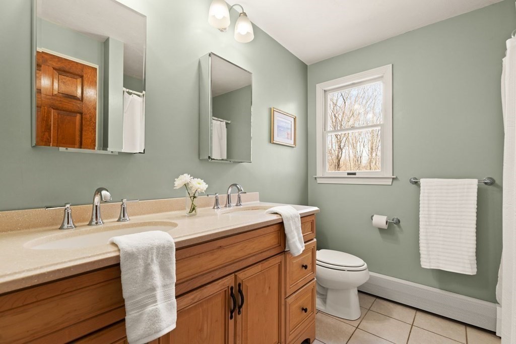 166 Edge Hill Road Sharon, MA 02067 - Photo 27 of 34 a bathroom with a granite countertop toilet sink and mirror