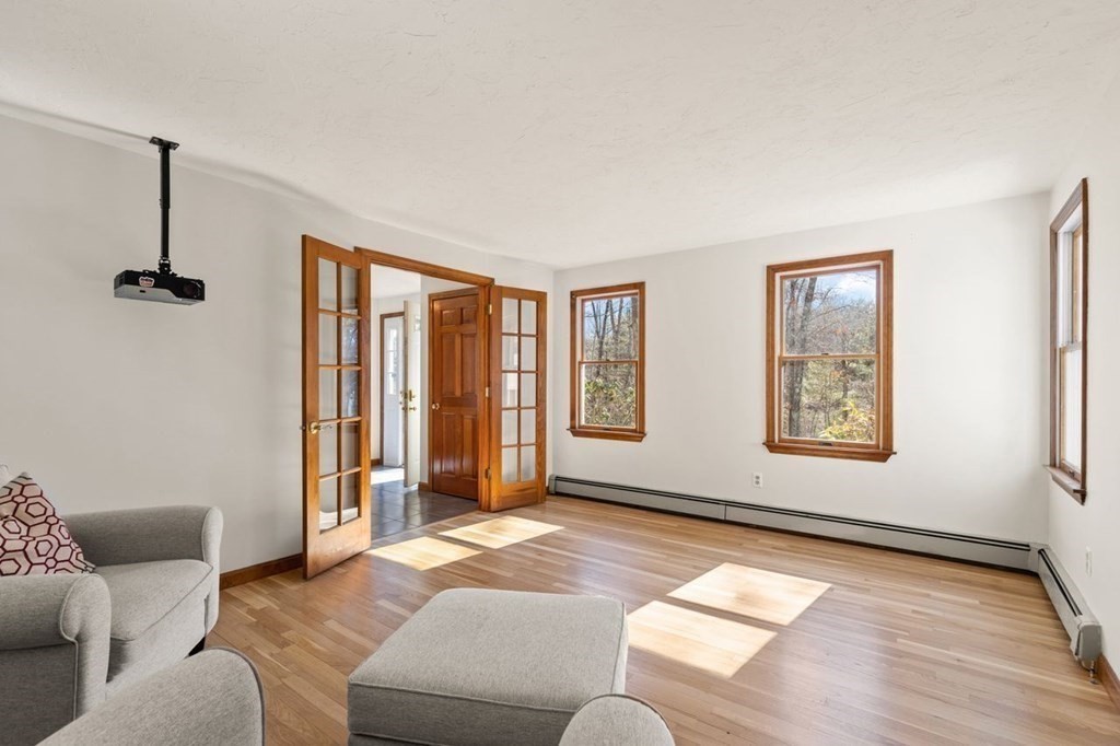 166 Edge Hill Road Sharon, MA 02067 - Photo 8 of 34 a living room with furniture and a window
