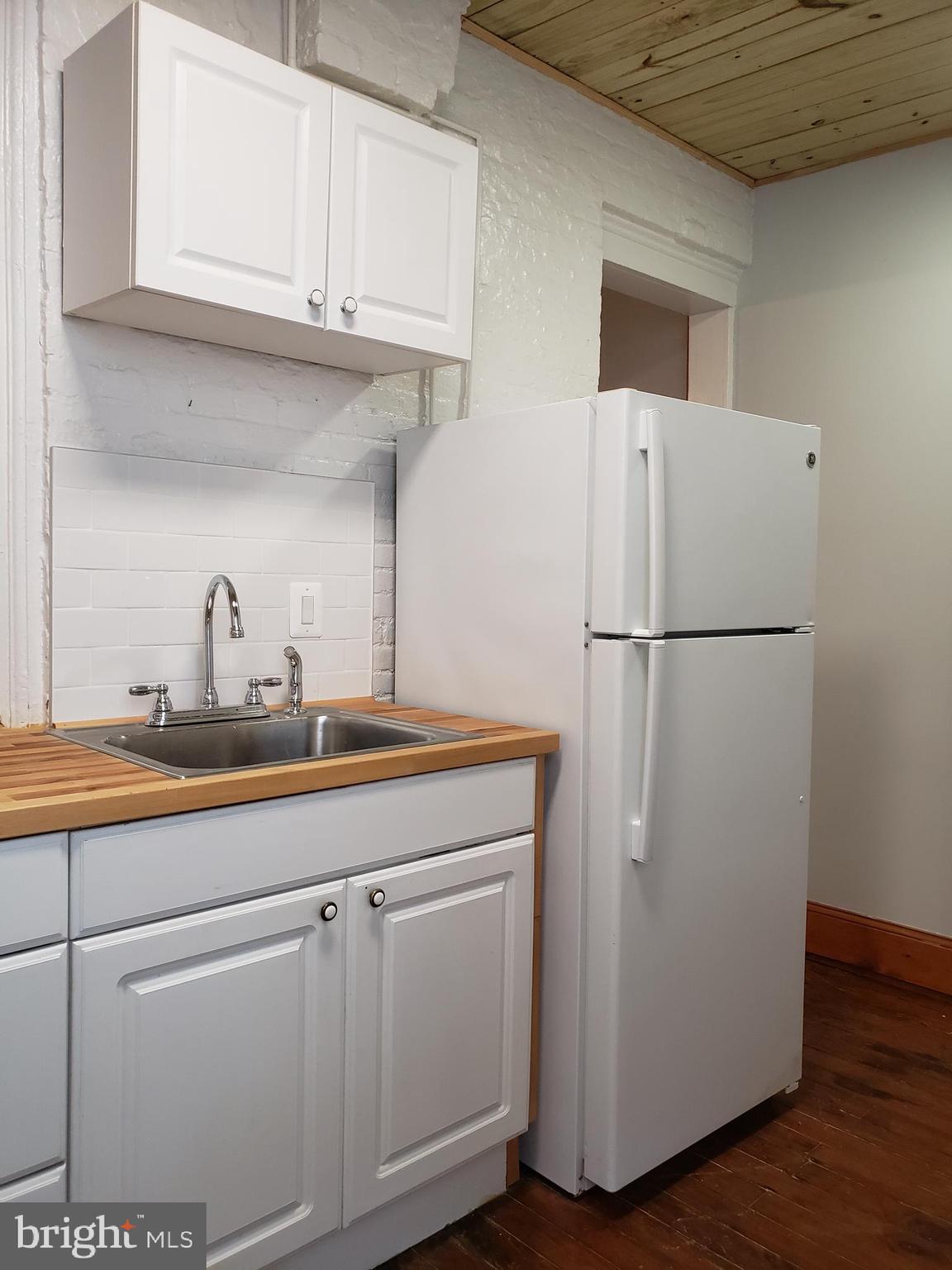 1623 Webster Street Philadelphia, PA 19146 - Photo 15 of 36 a white refrigerator freezer sitting inside of a kitchen