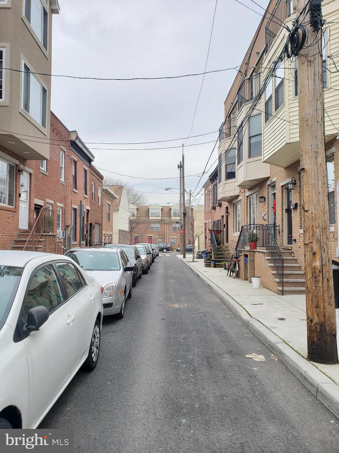 1623 Webster Street Philadelphia, PA 19146 - Photo 2 of 36 a view of a street with a car parked on the road