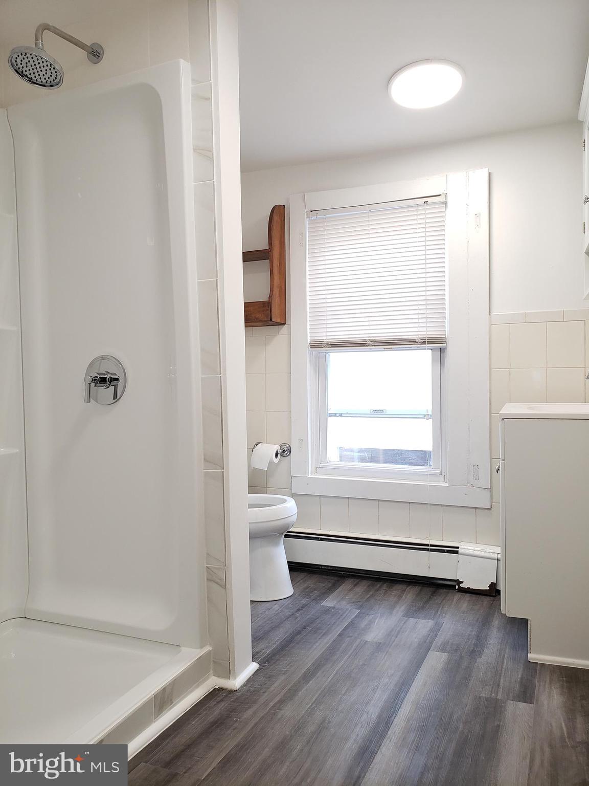 1623 Webster Street Philadelphia, PA 19146 - Photo 29 of 36 a bathroom with a bathtub and a shower
