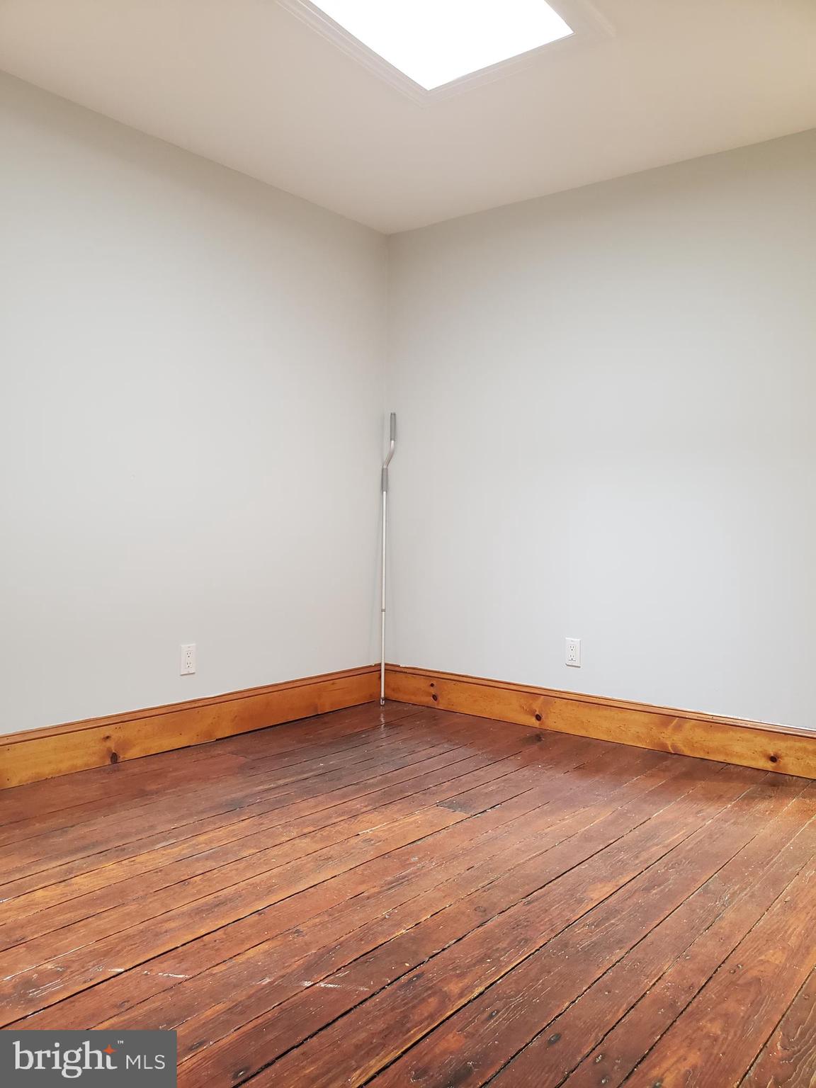 1623 Webster Street Philadelphia, PA 19146 - Photo 33 of 36 a view of an empty room with wooden floor