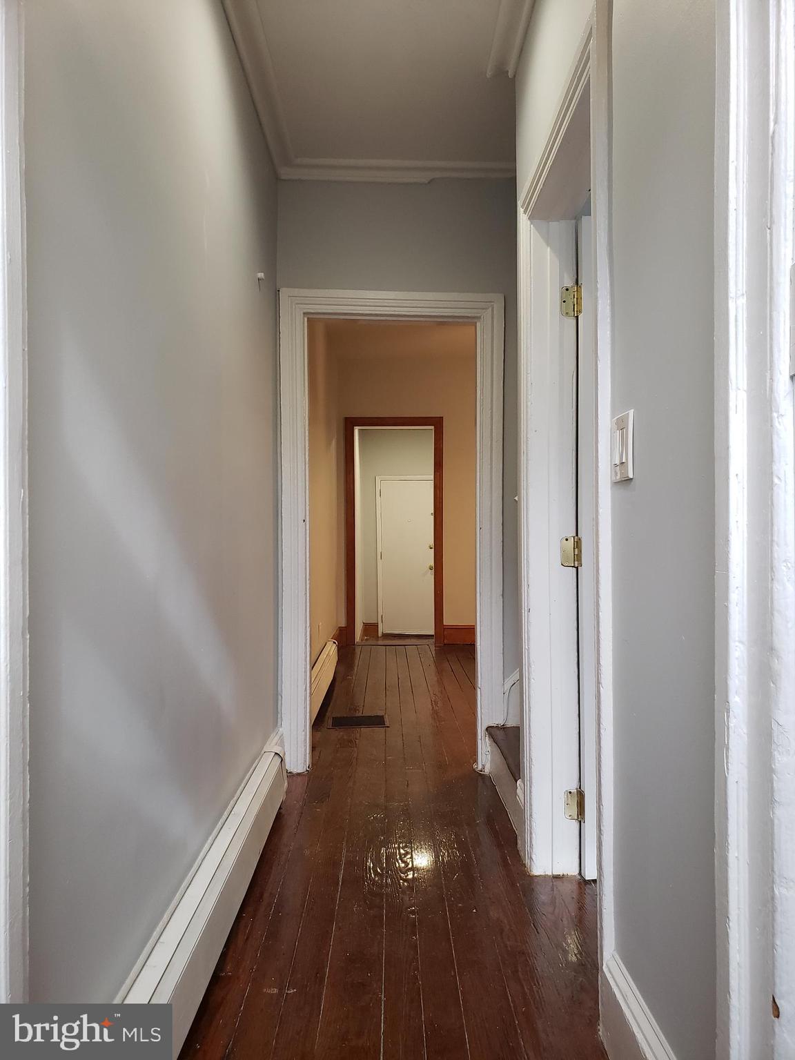 1623 Webster Street Philadelphia, PA 19146 - Photo 6 of 36 a view of a hallway with wooden floor