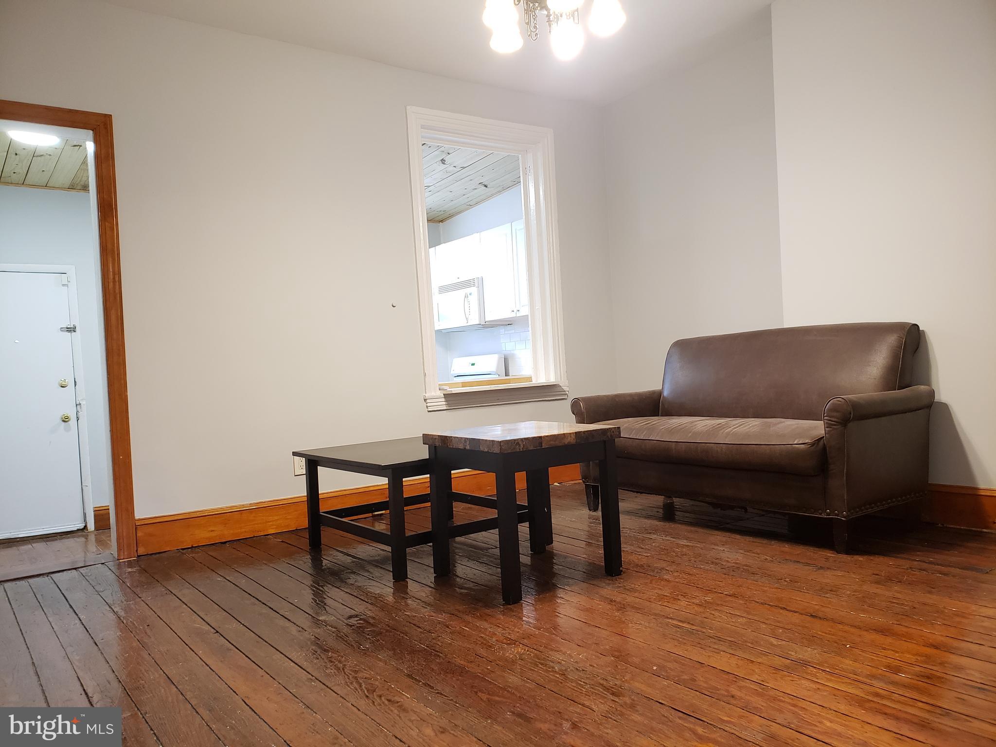 1623 Webster Street Philadelphia, PA 19146 - Photo 7 of 36 a living room with furniture and a wooden floor