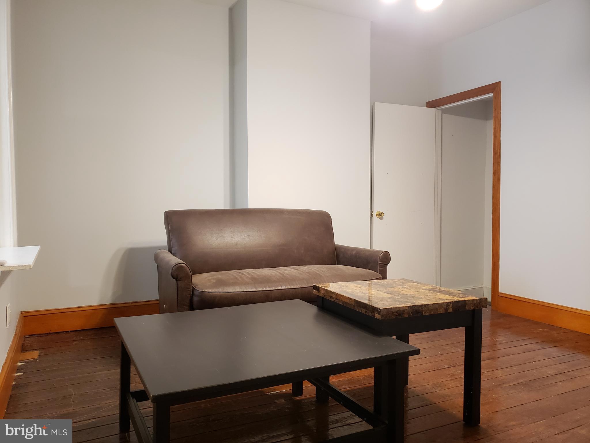1623 Webster Street Philadelphia, PA 19146 - Photo 9 of 36 a living room with furniture and wooden floor
