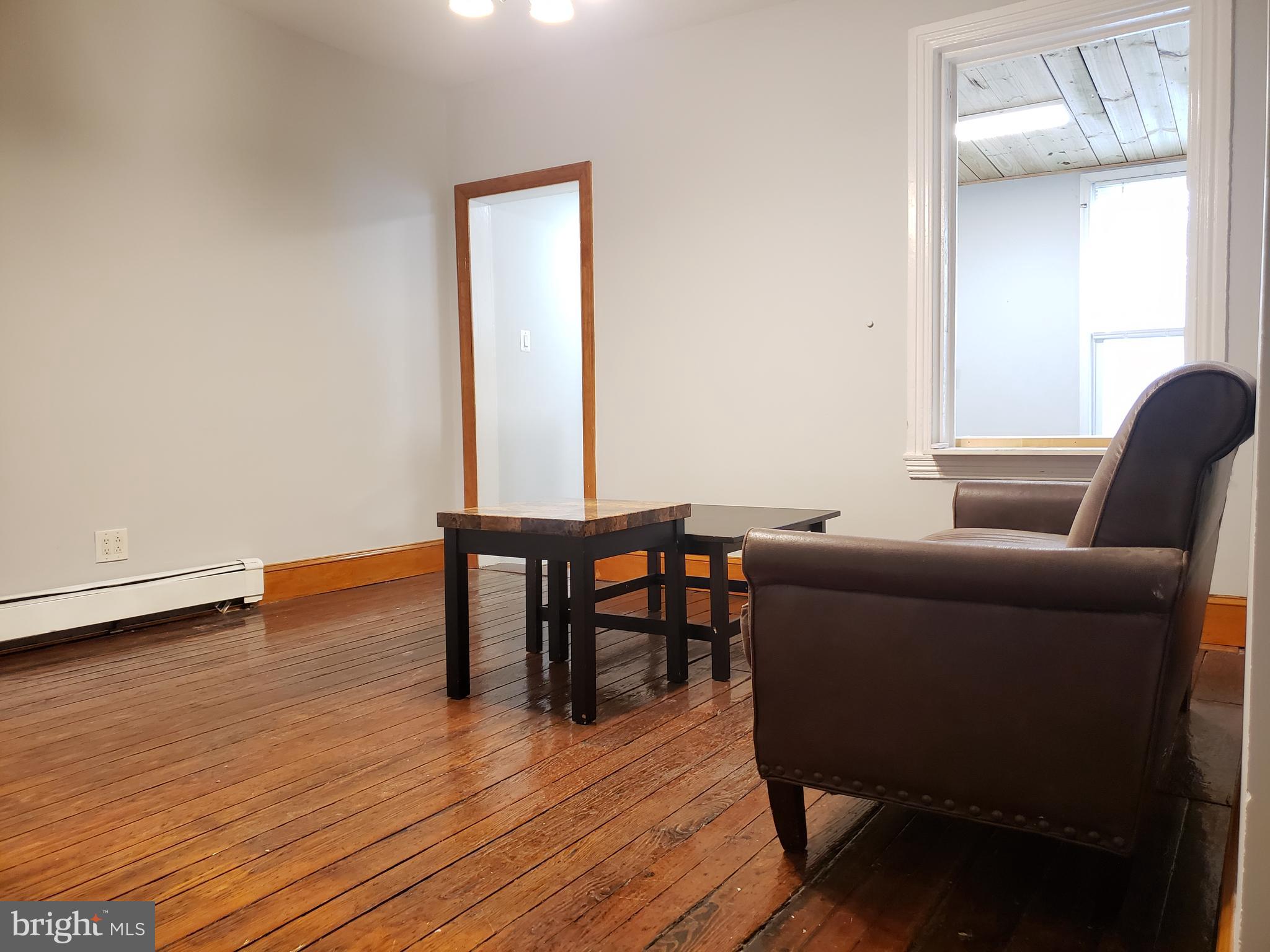 1623 Webster Street Philadelphia, PA 19146 - Photo 10 of 36 a living room with furniture and a wooden floor