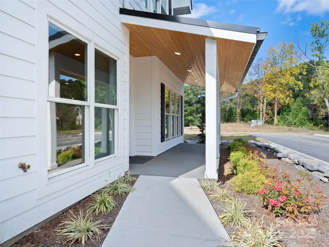 a view of room with window and wooden floor