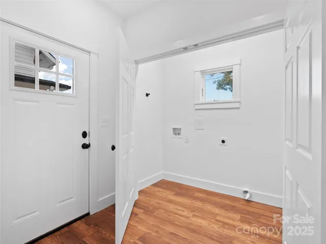 a view of a livingroom with a ceiling fan & window