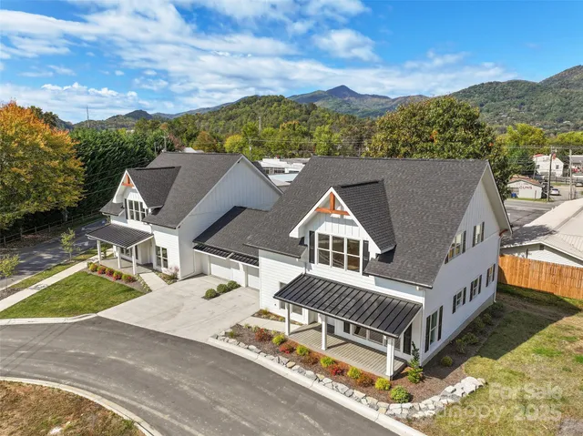 an aerial view of a house with a balcony