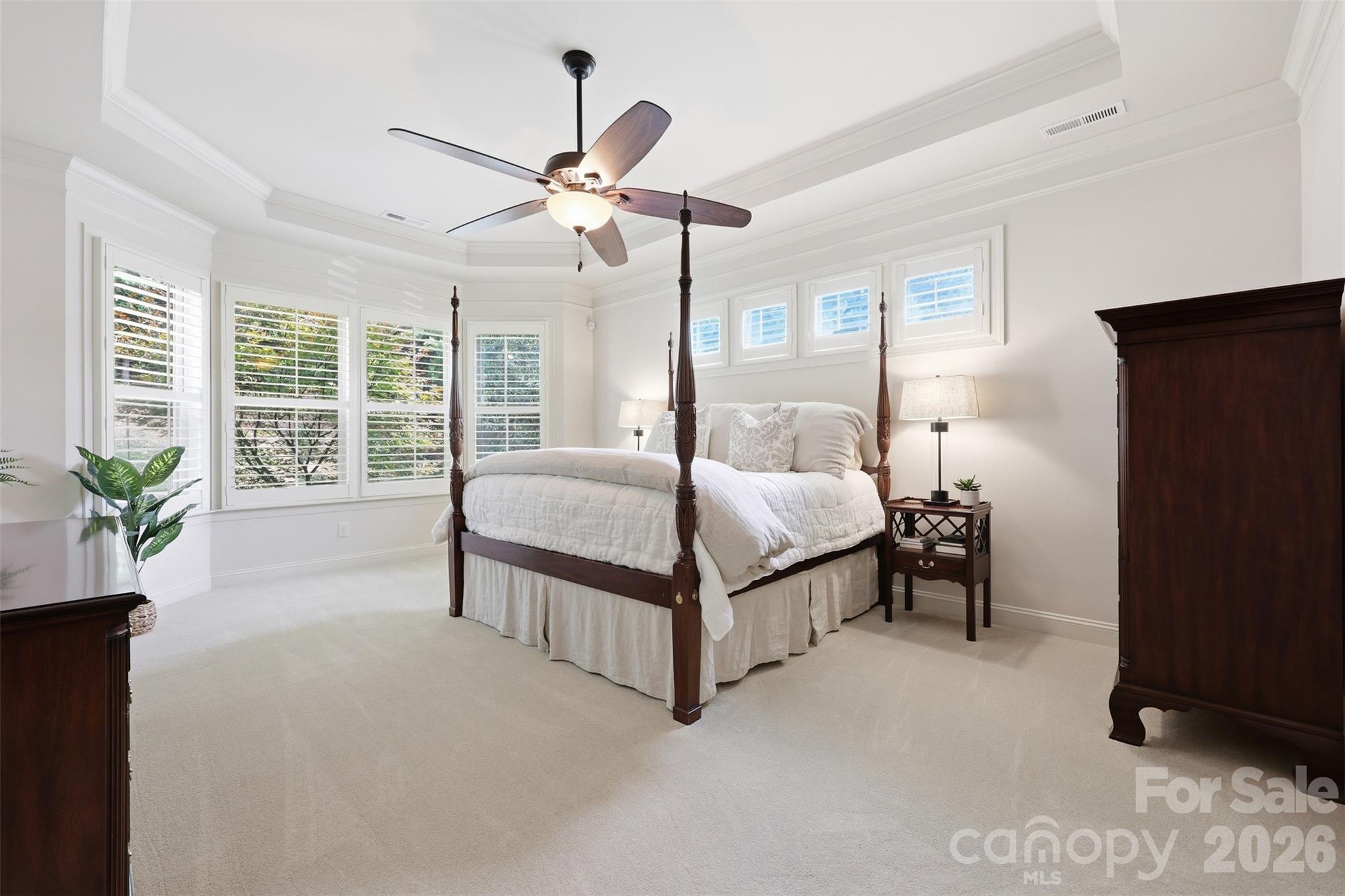 8094 Clems Branch Road Indian Land, SC 29707 - Photo 6 of 38 a bedroom with a bed lamp and a large window