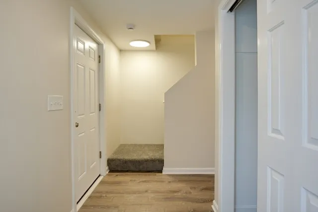 a bedroom with a bed and a mirror