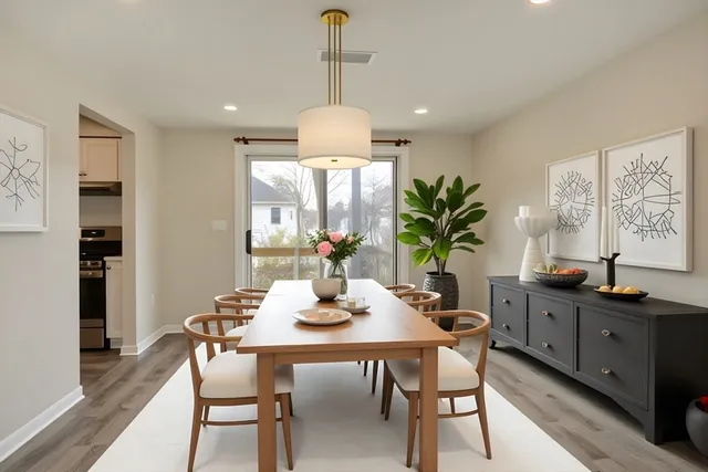 a dining room with furniture and window