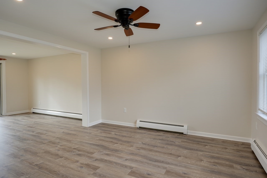 49 Douglas Avenue, Unit 49 Maynard, MA 01754 - Photo 5 of 23 wooden floor in an empty room