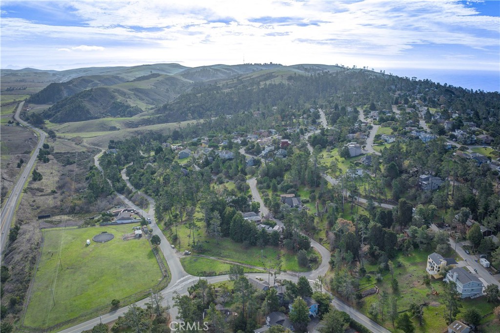 1981 Green Street Cambria, CA 93428 - Photo 12 of 16 a view of a lake with a mountain in the background