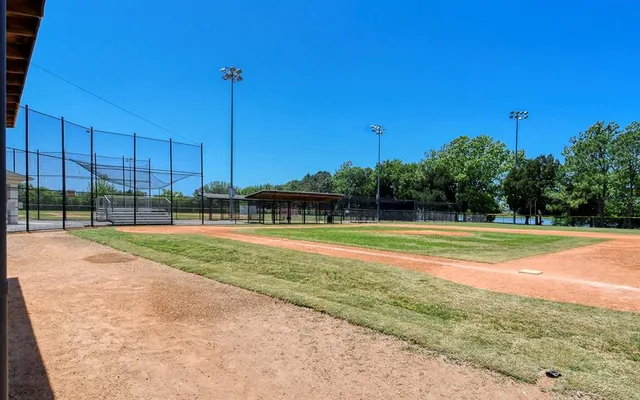 a view of a swimming pool with a yard