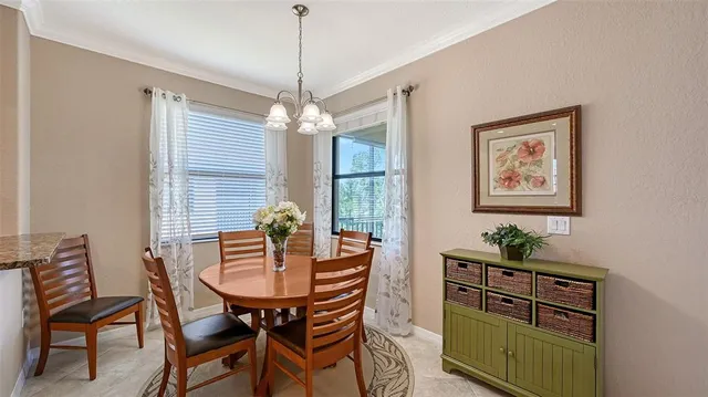 a dining room with furniture and window