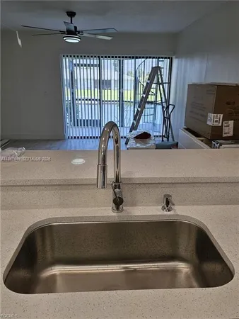 a kitchen with a sink and a window