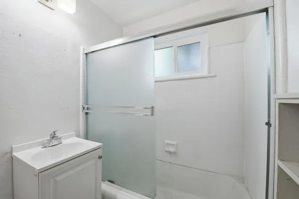 a bathroom with a sink toilet and vanity