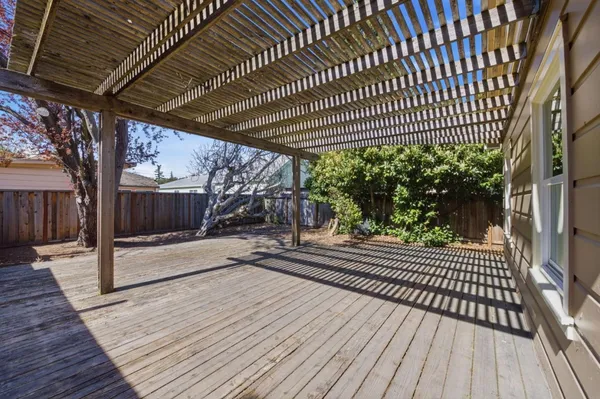 a view of a patio with wooden floor