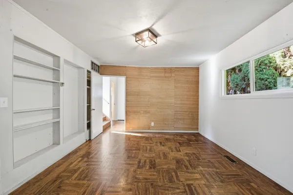 a view of an empty room with a window