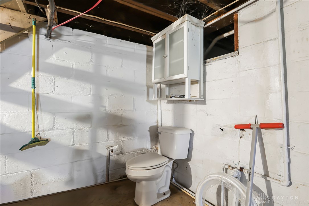 2390 Ridge Road Zanesville, OH 43701 - Photo 28 of 45 This basement bathroom offers essential functionality within a utilitarian space.