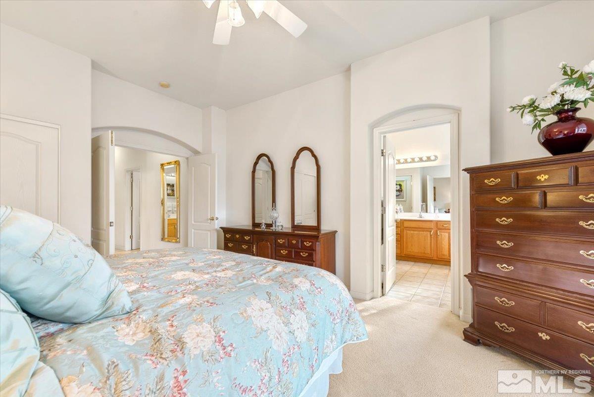 10055 Kentfield Place Reno, NV 89521 - Photo 20 of 39 a bedroom with a bed and a dresser