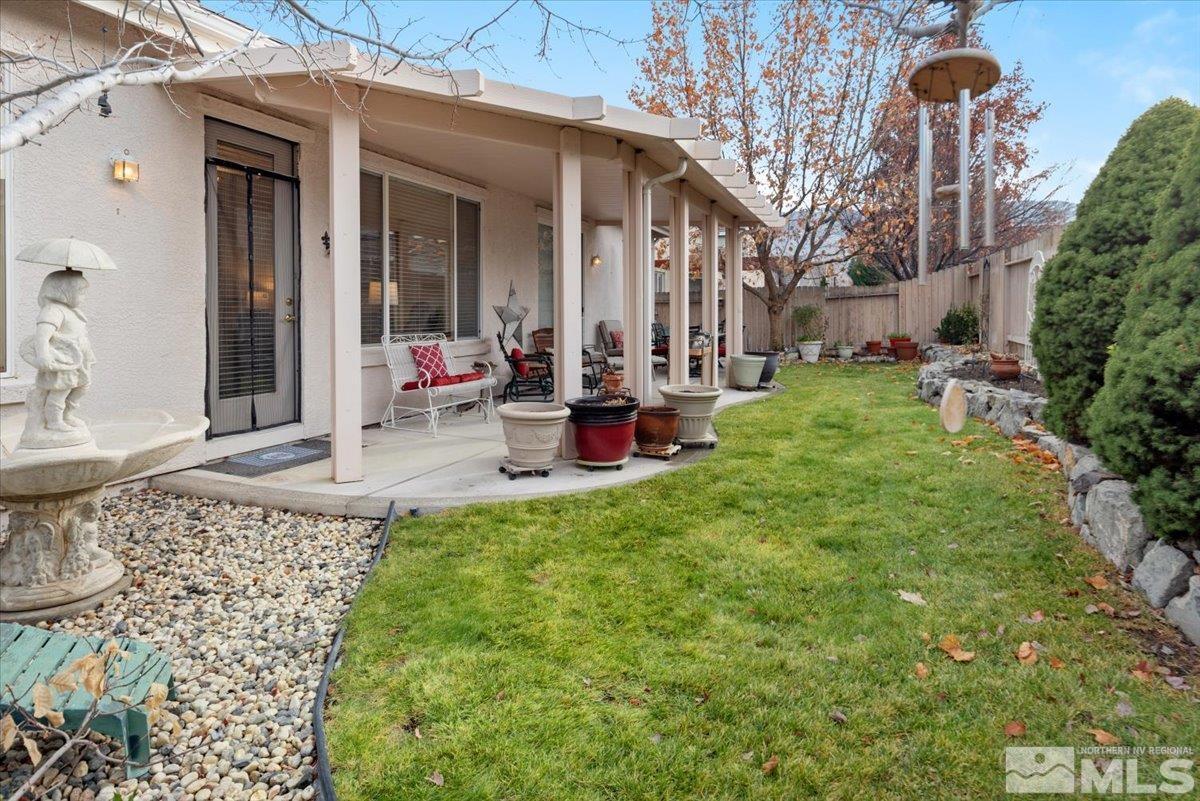 10055 Kentfield Place Reno, NV 89521 - Photo 34 of 39 a view of a house with backyard and sitting area