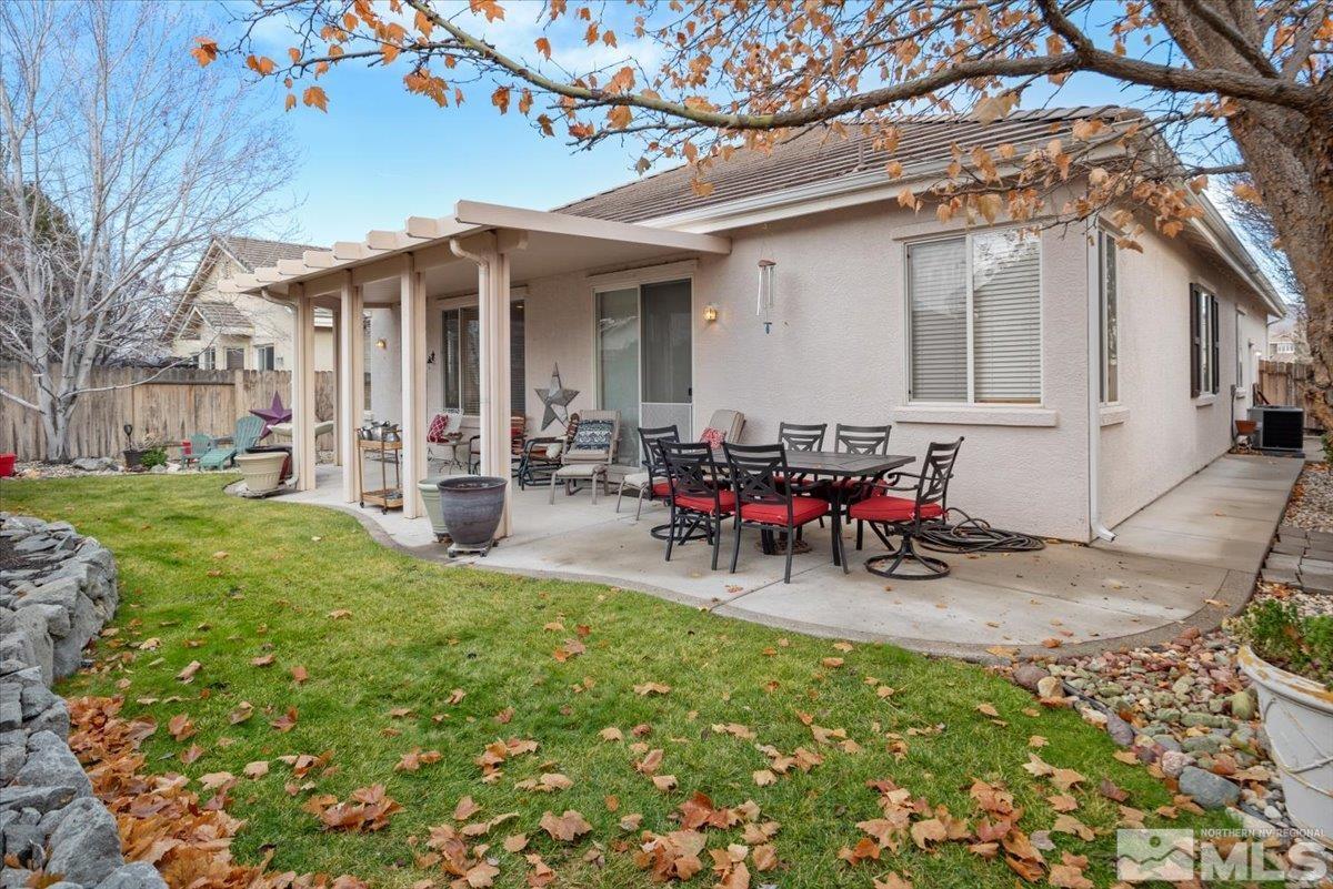10055 Kentfield Place Reno, NV 89521 - Photo 35 of 39 a view of a house with backyard porch and sitting area