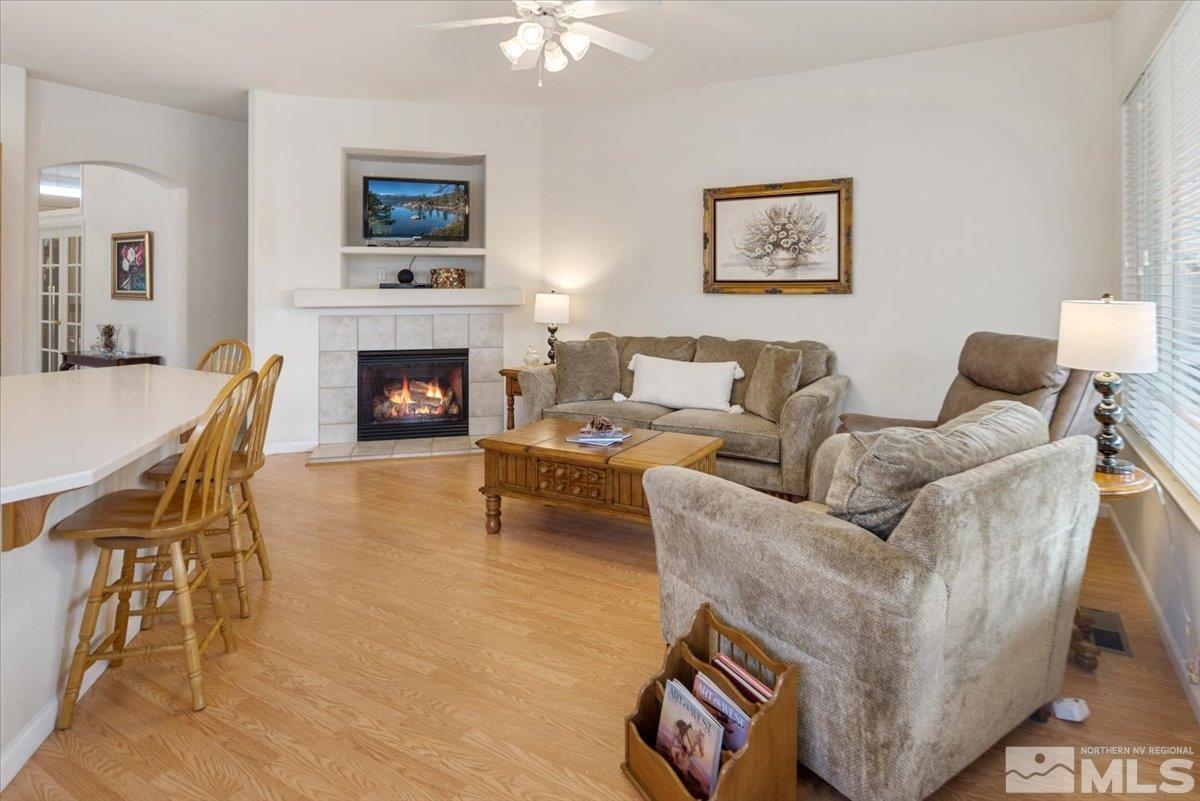 10055 Kentfield Place Reno, NV 89521 - Photo 7 of 39 a living room with furniture and a fireplace
