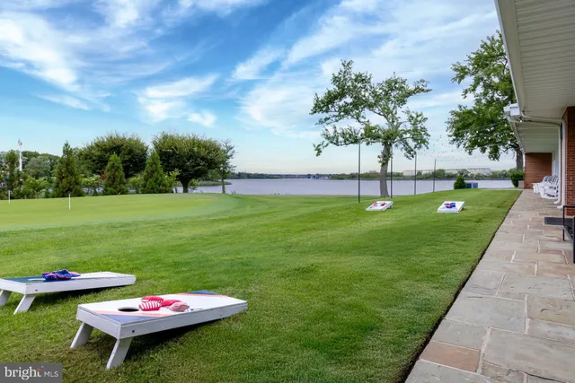 a view of a swimming pool and lounge chairs