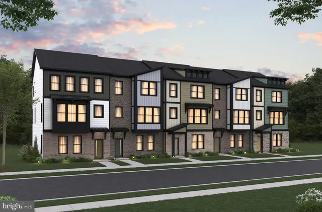 a kitchen with a refrigerator and a view of living room