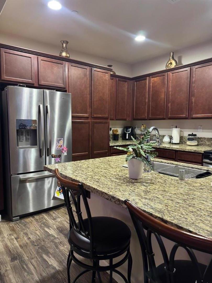 638 Robledo Drive Soledad, CA 93960 - Photo 6 of 7 a kitchen with a table chairs refrigerator and sink