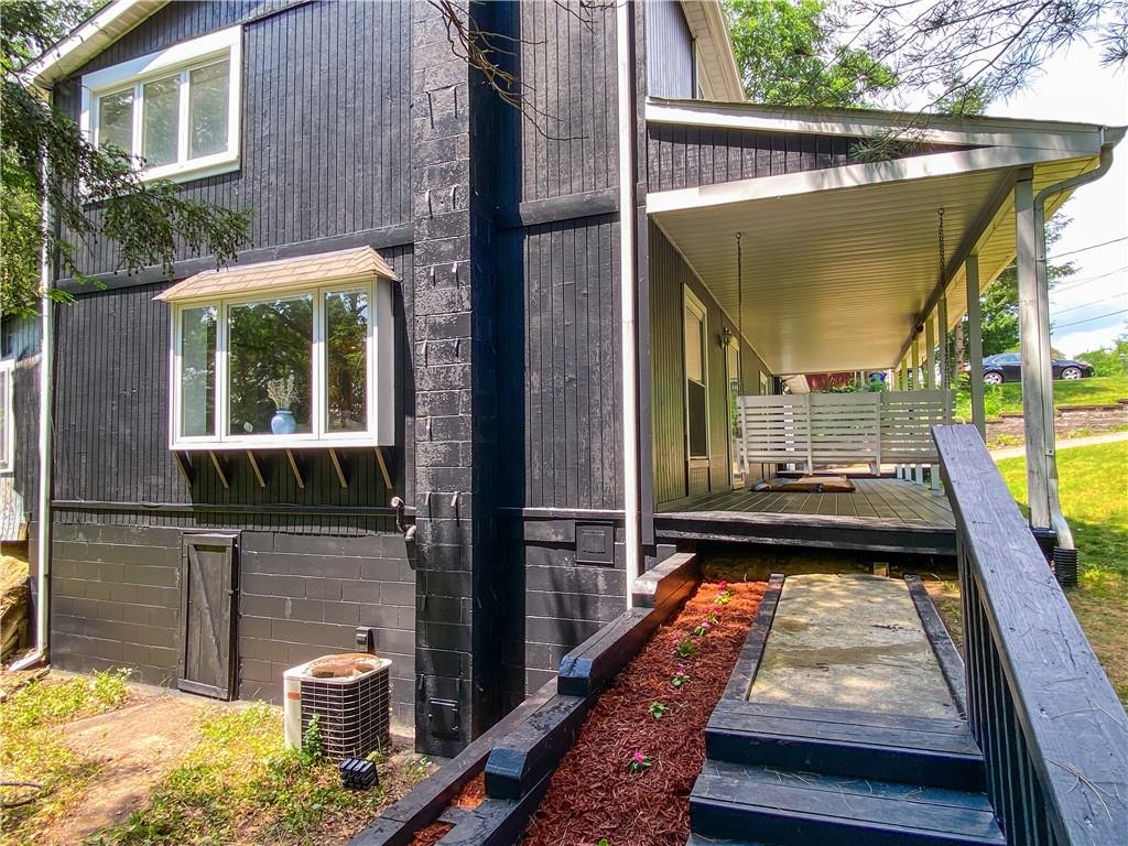1310 Center Road Monaca, PA 15061 - Photo 10 of 32 Side of the house with a door to crawl space