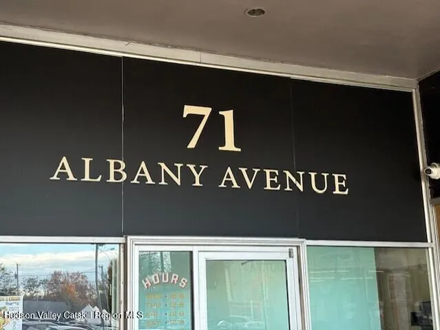 a black and white photo of a street sign