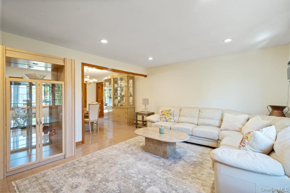 91 15th Avenue West Babylon, NY 11704 - Photo 12 of 33 a living room with furniture and a large window