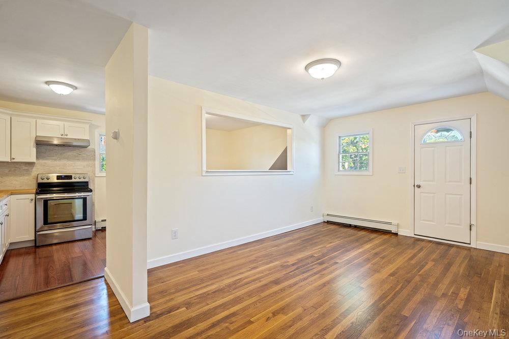91 15th Avenue West Babylon, NY 11704 - Photo 18 of 33 a view of kitchen and wooden floor