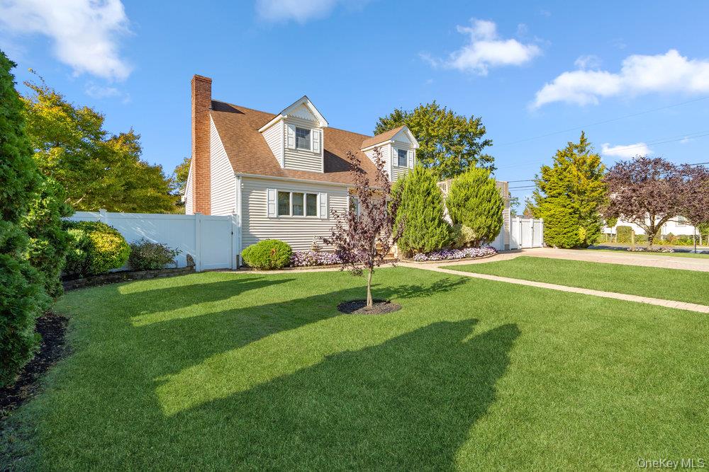91 15th Avenue West Babylon, NY 11704 - Photo 3 of 33 a front view of a house with garden