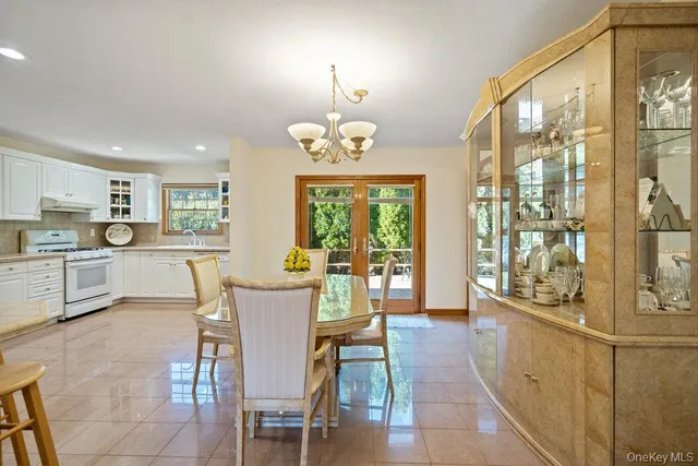 a view of a dining room with furniture window and outside view
