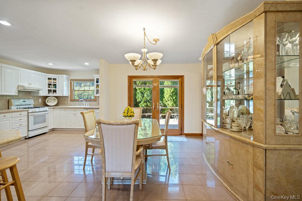 91 15th Avenue West Babylon, NY 11704 - Photo 8 of 33 a view of a dining room with furniture window and outside view