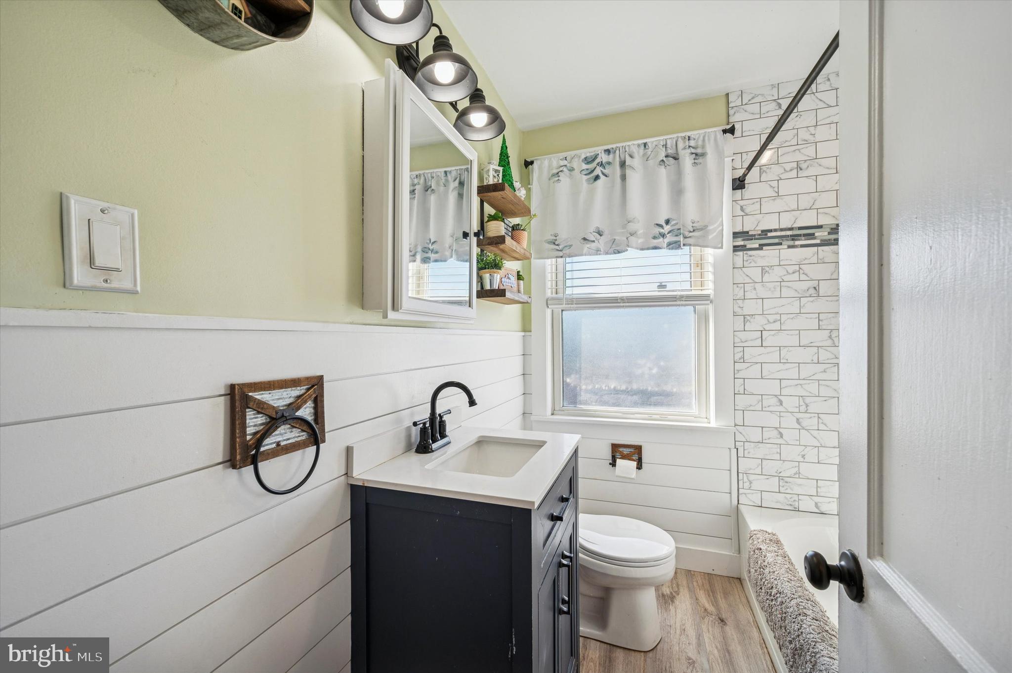 220 Sedgewood Road Springfield, PA 19064 - Photo 18 of 27 a bathroom with a toilet sink and mirror