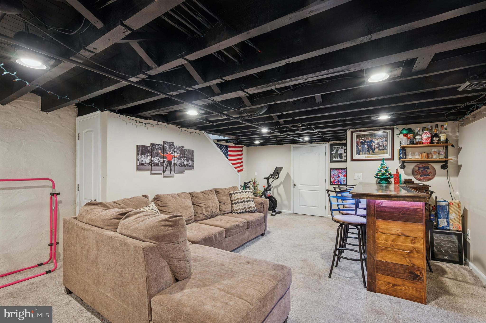 220 Sedgewood Road Springfield, PA 19064 - Photo 23 of 27 a couch sitting in a room next to a empty room