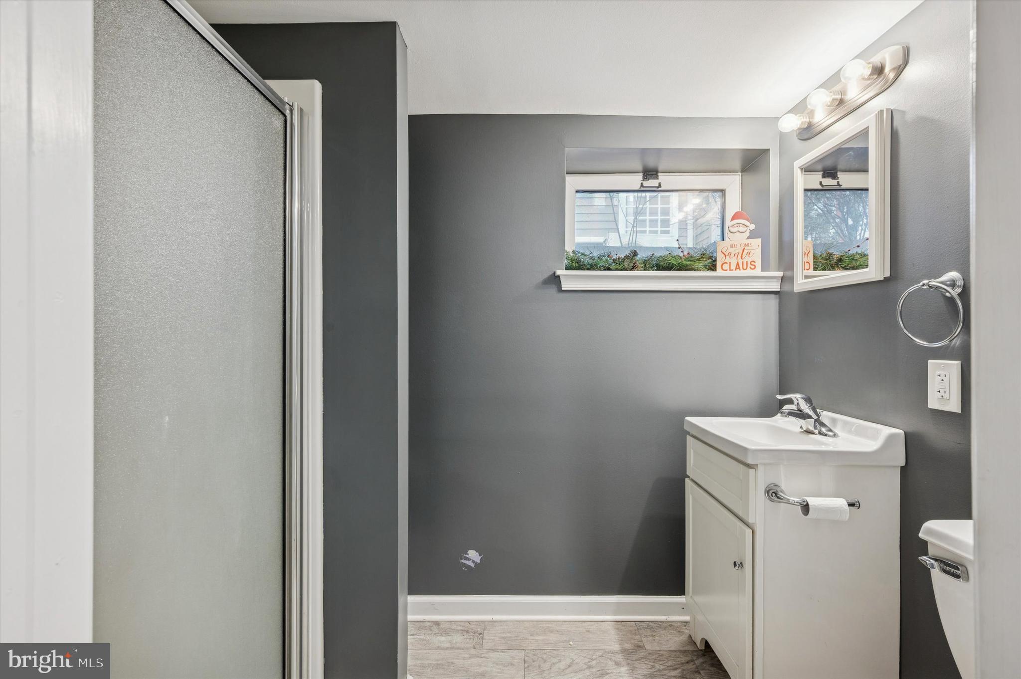 220 Sedgewood Road Springfield, PA 19064 - Photo 24 of 27 a bathroom with a sink mirror and toilet
