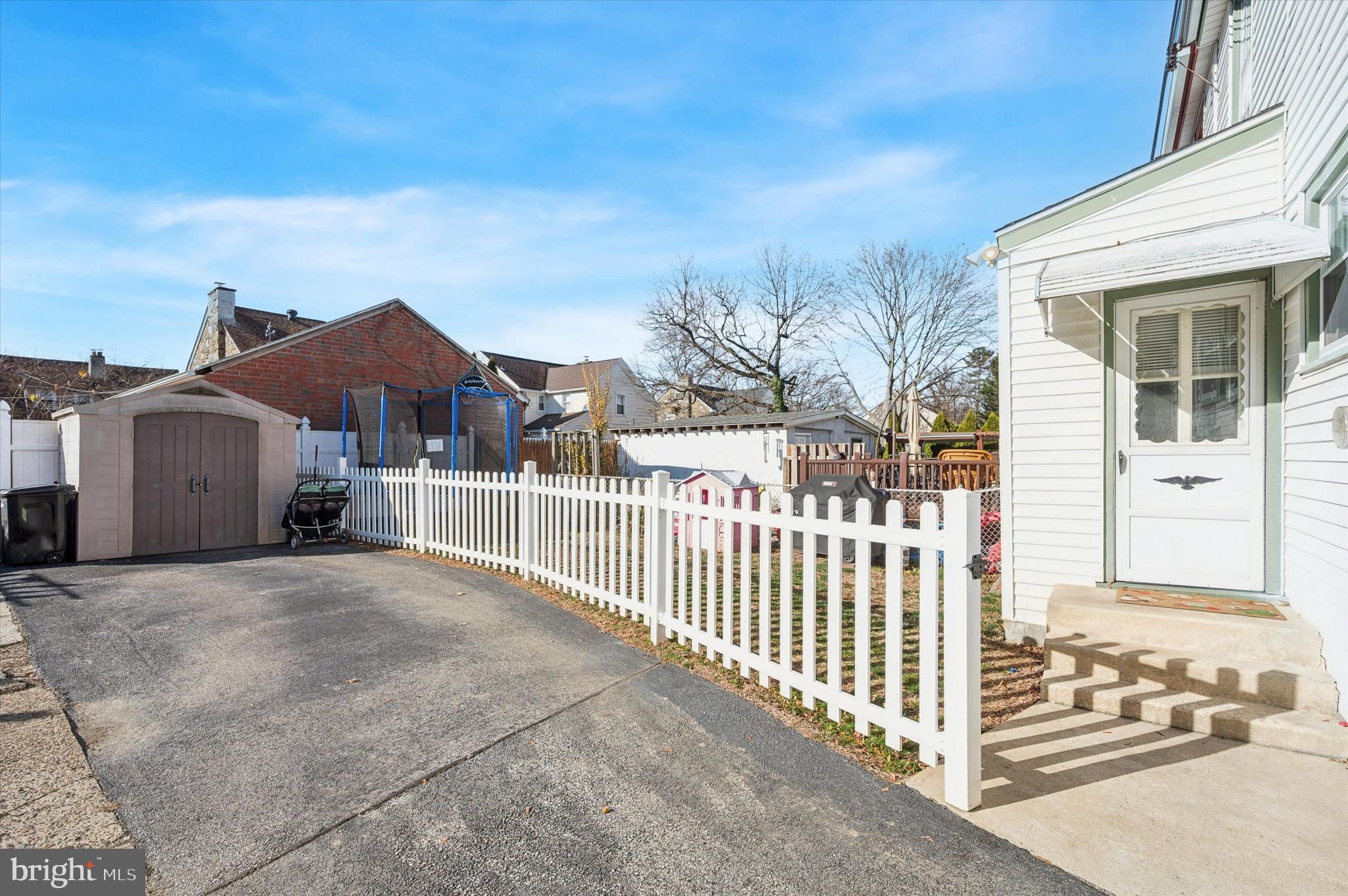220 Sedgewood Road Springfield, PA 19064 - Photo 26 of 27 a view of a house with a small yard and wooden fence