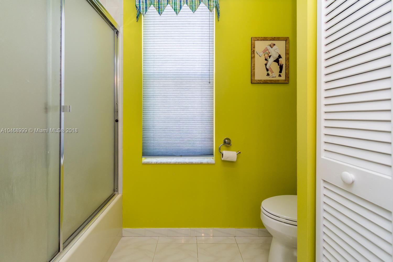 450 Alexandra Circle Weston, FL 33326 - Photo 53 of 84 a bathroom with a toilet and a sink