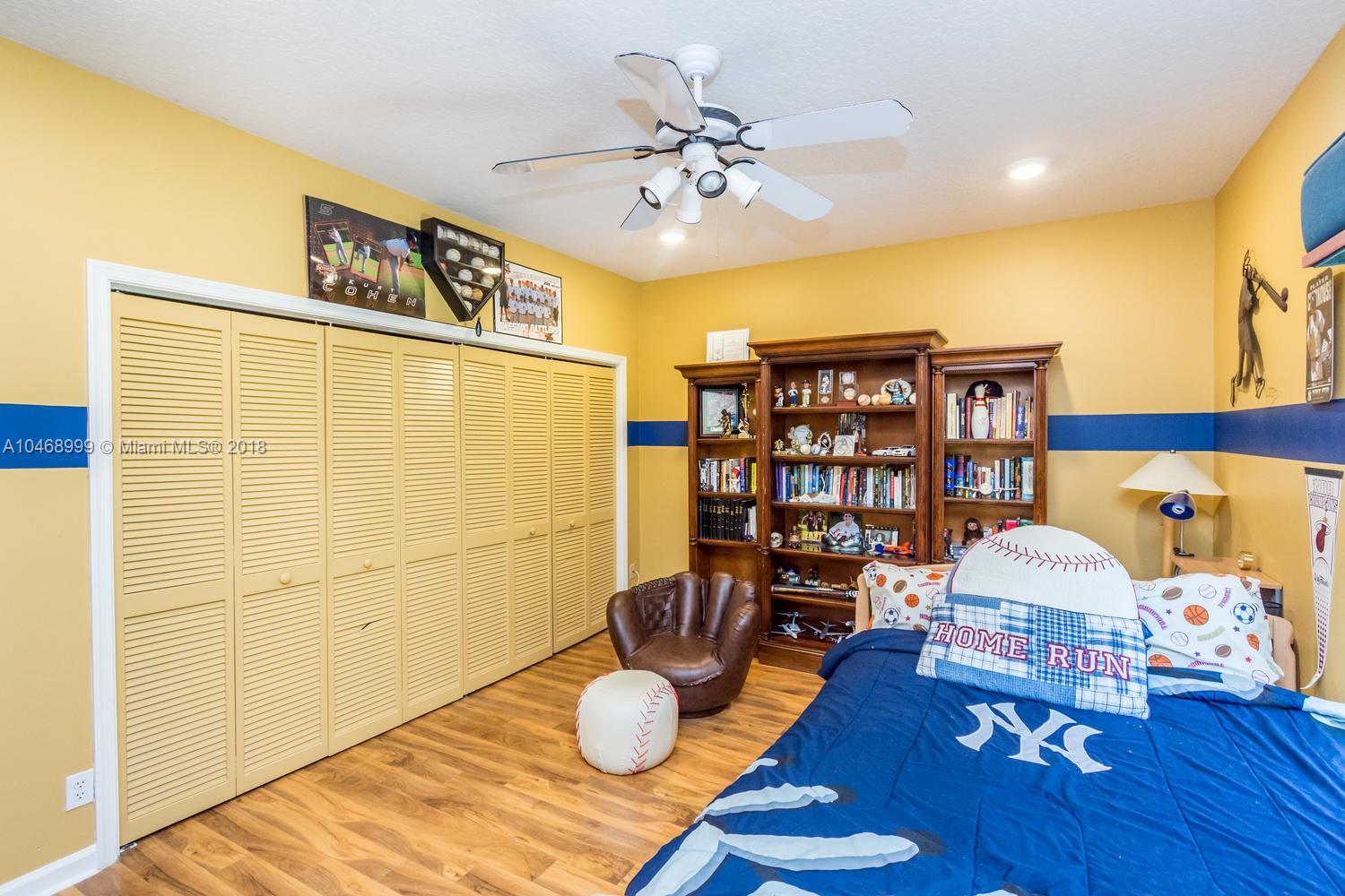 450 Alexandra Circle Weston, FL 33326 - Photo 57 of 84 a living room with furniture and wooden floor