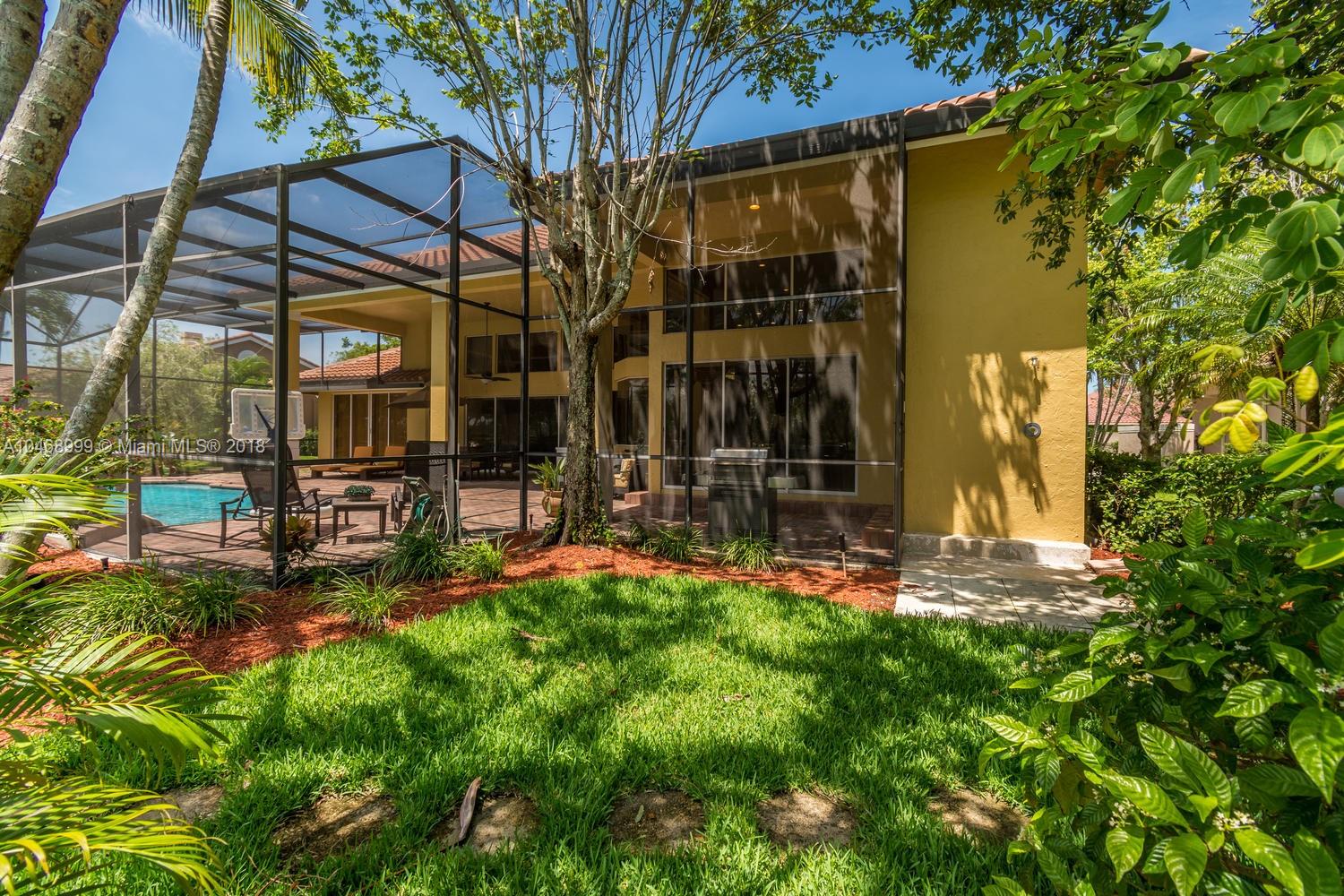 450 Alexandra Circle Weston, FL 33326 - Photo 82 of 84 front view of a house with a yard
