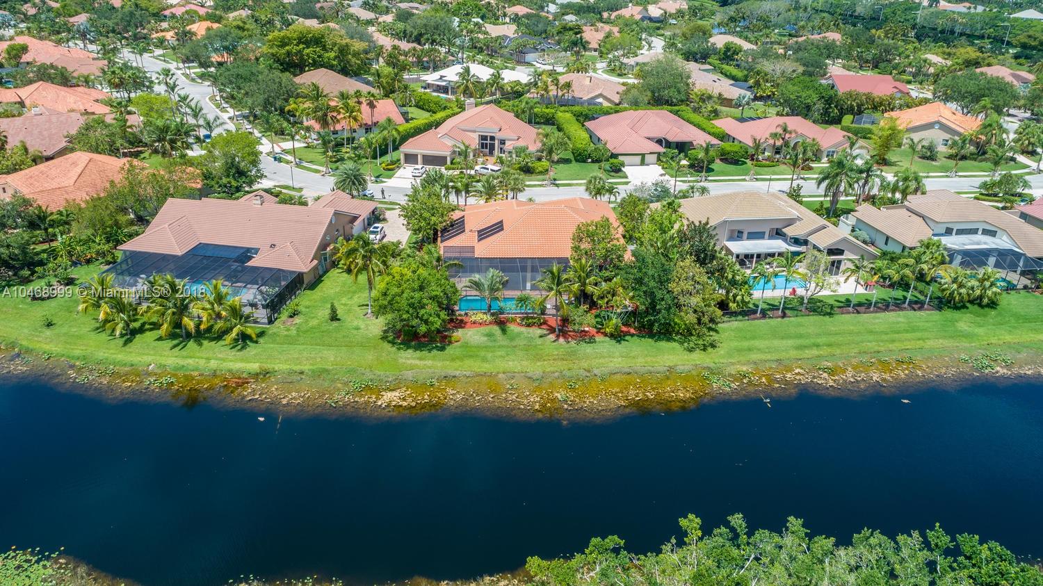 450 Alexandra Circle Weston, FL 33326 - Photo 83 of 84 an aerial view of residential houses with outdoor space and lake view