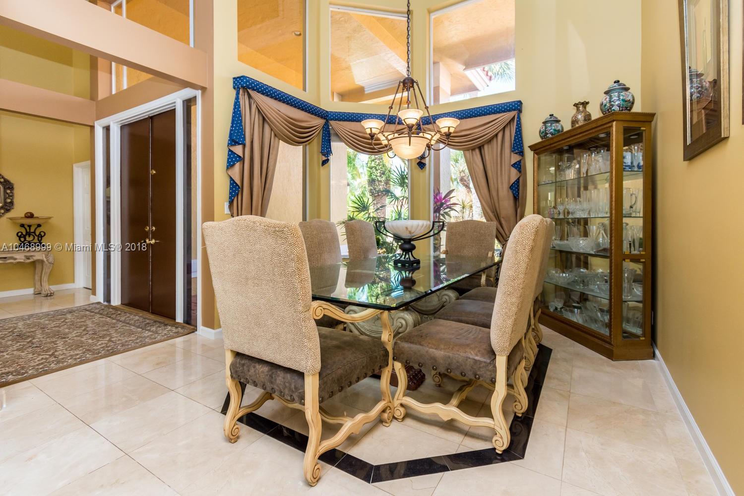 450 Alexandra Circle Weston, FL 33326 - Photo 9 of 84 a view of a chairs and table in the balcony